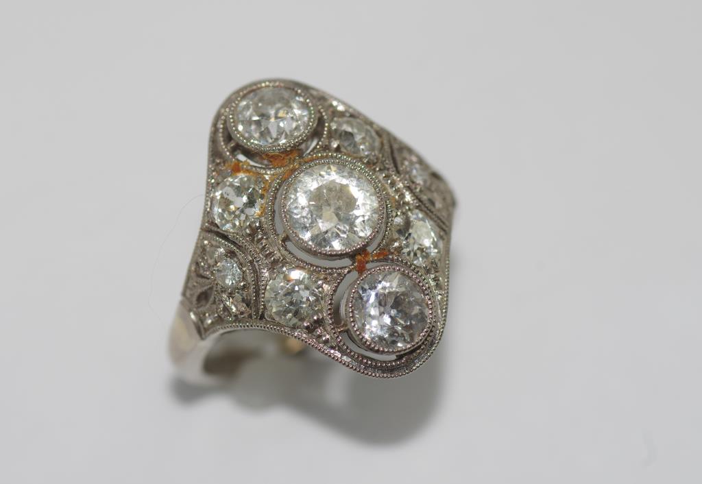 Art Deco 18ct white gold & 9 stone diamond ring centre stone 0.65ct, Total diamond weight 2.46ct.