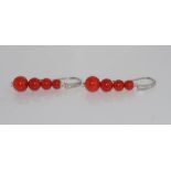 Graduated Chinese red bamboo coral earrings set in silver
