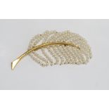 Vintage pearl enhanced feather shaped brooch in gilt metal