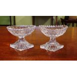 Two Georgian cut crystal salts with lemon squeezer bases, 8cm high approx