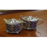Pair of Hardy Bros sterling silver mustard pots with pierced sides & blue glass liners, hallmarked