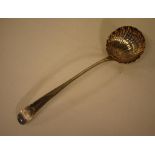 George III Irish sterling silver soup ladle with a shell-shaped bowl and bright-cut handle, crested,