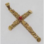 14ct yellow gold gemset cross with pierced arms decorated with leafs. Stamped 585. appox 5gms