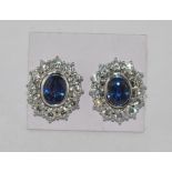 Pair of white gold, diamond & sapphire earrings set in 18ct white gold, each with a central Ceylon