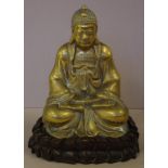 Brass seated Buddha on carved timber stand 24cm high