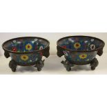 Two early large Chinese cloisonne bowls with bird and floral decoration, on three figural feet,