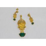 Yellow gold Peruvian pendant & earrings marked 18K, shaped as TUMI and set with "Peruvian