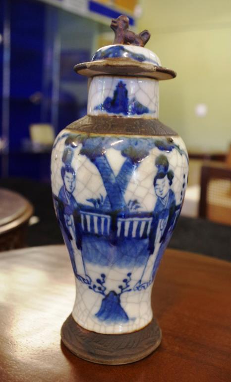 Early Chinese crackle glazed lidded vase blue and white court yard scene, repair to lid and vase,