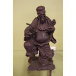 Oriental carved figure 22.5cm high