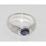 18ct white gold, diamond and sapphire ring sapphire - 0.72ct, the 24 diamonds total 0.2ct, weight: