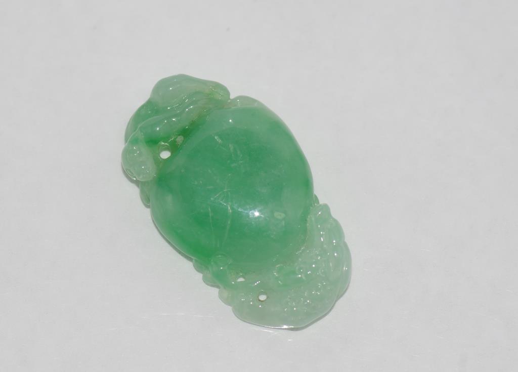 Carved green jade pendant with snake and peach size: approx 3cm length