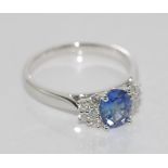 18ct white gold, sapphire & diamond ring. the central Ceylon sapphire is 1.1ct, with five diamonds