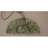 Oriental jade stoneware disc 11 cm long, 5 cm high