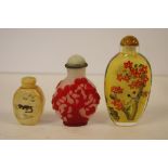 Three assorted snuff bottles 9.5cm high (tallest)