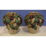 Pair of large majolica pottery vases encrusted with grape vines on a crackle glazed body, 33cm high