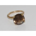 9ct yellow gold and brown stone ring tests suggest smokey quartz, weight: approx 3.9 grams, size: