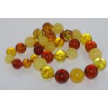 Matinee length multi-colour Baltic amber necklace including butterscotch amber