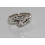18ct white gold and diamond ring set Engagement ring: single claw set diamond with smaller channel