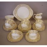 Royal Doulton 'Sovereign' teaset for 8 comprising of 8 trios, a cake plate, milk jug and sugar bowl
