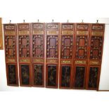 Seven Chinese Qing window shutters with pull down openings, 140cm high, 28cm wide (each)