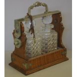 Victorian English two bottle tantalus oak cased with keys, 29cm high approx.