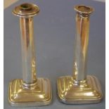 Pair of sterling silver candlesticks hallmarked Sheffield 1909, 23cm high (tallest) approx., as