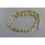 Cream and golden pearl necklace approx 49cm in length