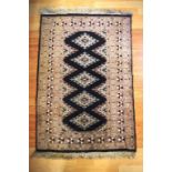 Vintage middle eastern woolen rug in black and lavender tones, 112cm X 76cm approx
