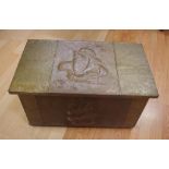 Copper covered fireside box on 4 castors with raised sailing ship design to lid and front, 61 x 36