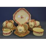 Royal Doulton 'Raby Rose' part tea set to include 9 trios , cake plate, sugar and creamer