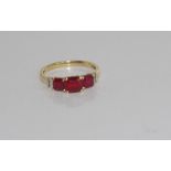 9ct yellow gold and ruby ring (synthetic rubies) with 2 diamonds at each shoulder, weight: approx
