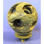 Chinese carved green stone puzzle ball on stand 12cm high approx