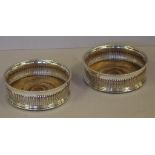 Two silver plated bottle coasters 14cm diameter approx.