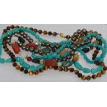 Five various necklaces including turquoise and tiger's eye