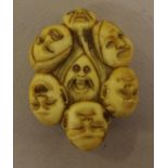 Vintage carved bone "faces"netsuke