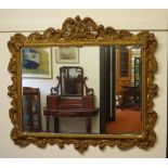 Large ornate gilt framed mirror 130cm wide, 116cm high