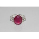 18ct white gold, ruby (5.27ct) and diamond ring includes treated ruby and diamond (19pts), weight: