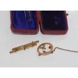 Vintage boxed 9ct bar brooch weight: approx 1.6 grams together with a 9ct brooch (pin needs