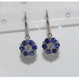 18ct white gold, diamond & sapphire daisy earrings each earring has 6 Ceylon sapphires and 1