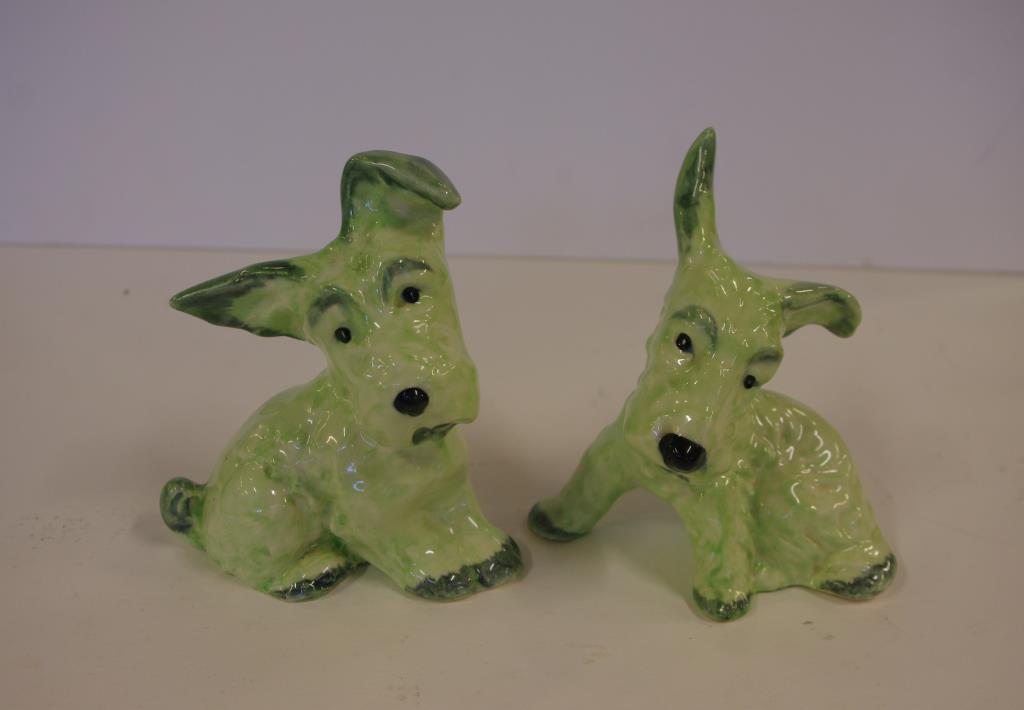 Pair of Wain Melba Ware dog figurines in green hues, 13.5 cm high