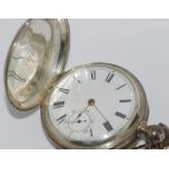 Silver full hunter pocket watch with key, marked A.M Watch Co Waltham Mass. Warranted Sterling