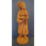 French 19thC terracotta girl with basket figurine marks to back, 67cm high approx.