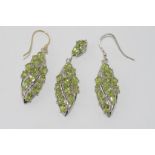 Silver and peridot earring and pendant set note: one earring has a silver gilt hook the other