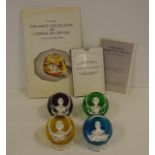 Four Baccarat "Royal Cameos In Crystal" paperweights, 7 cm diameter, 4.5 cm high, each with a
