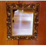 Ornate gilt framed mirror 73cm x 64cm approx