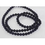 Long blue stone bead necklace