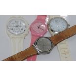 Three Swatch watches together with a similar watch