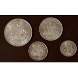 Four Australian 1910 silver coins comprising a florin, shilling, sixpence & threepence, EF/UNC