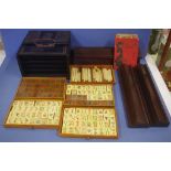 Vintage Chinese Mahjong set in decorative wooden box, together with four timber stands and