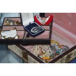 Box of costume jewellery and watches including boxed Harkison Scottish brooch, various earrings,